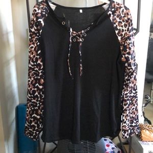 Leopard print/black top with criss/cross